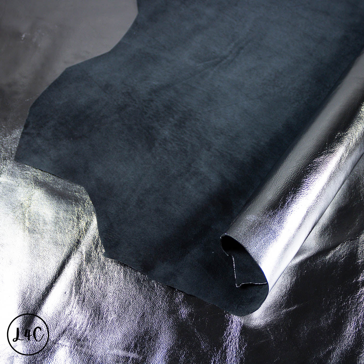 Dark gray leather texture on a textured surface