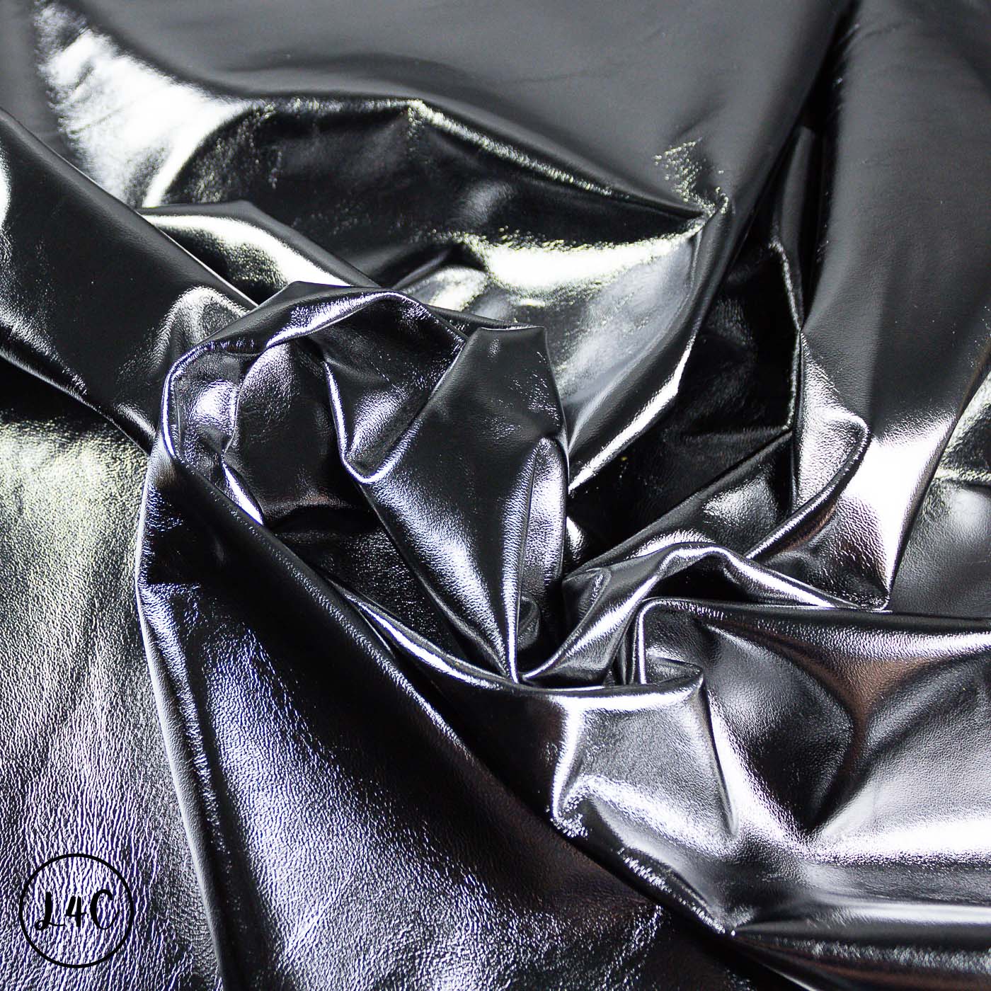 Close-up of metallic silver fabric with folds