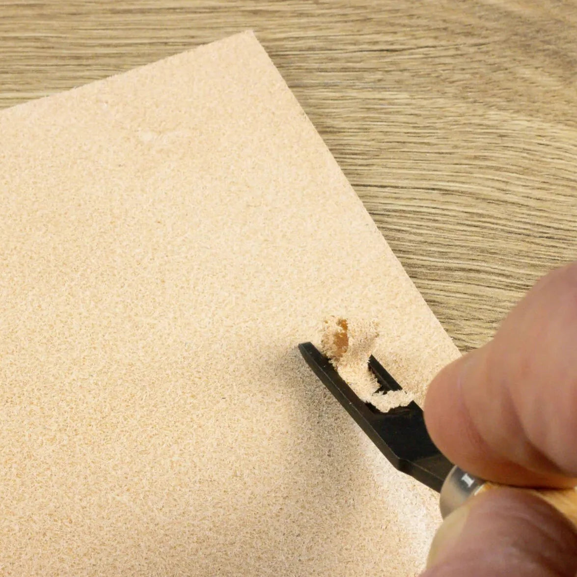 close up of using the French Edge Skiving Knife