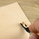 close up of using the French Edge Skiving Knife