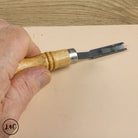 hand holding the French Edge Skiving Knife