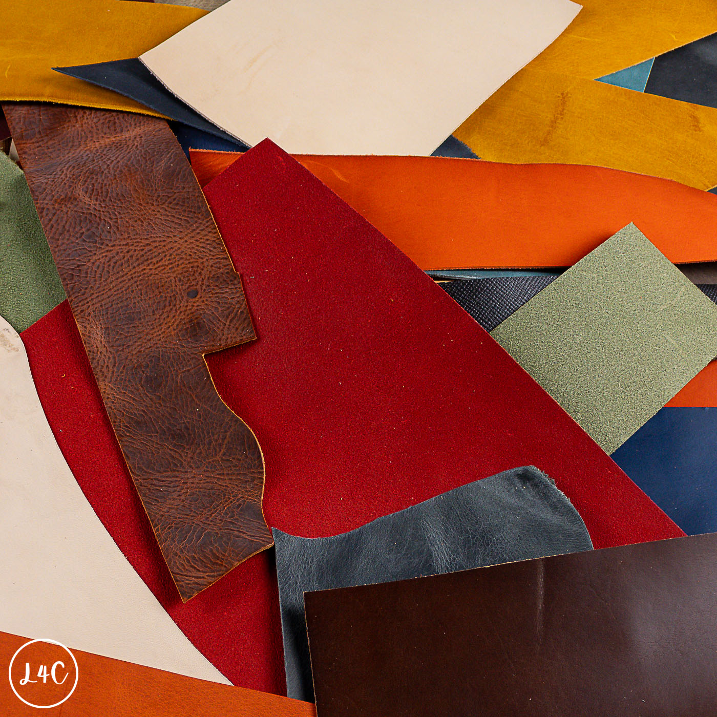 Collection of various leather off cuts in different colors and textures.