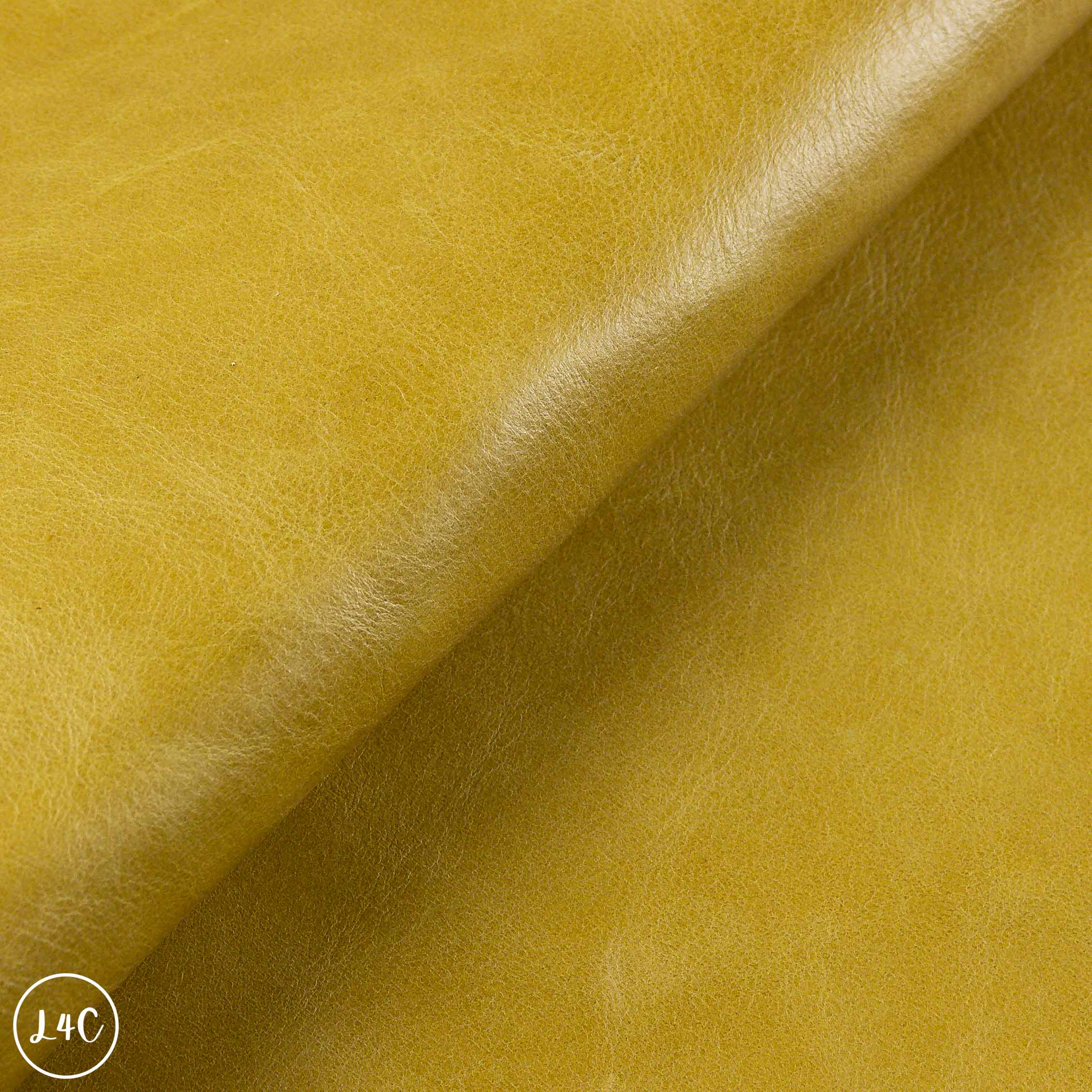 Close-up of yellow leather with a subtle texture