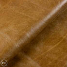 Close-up of brown leather fabric with visible texture