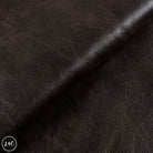 Close-up of dark brown leather texture