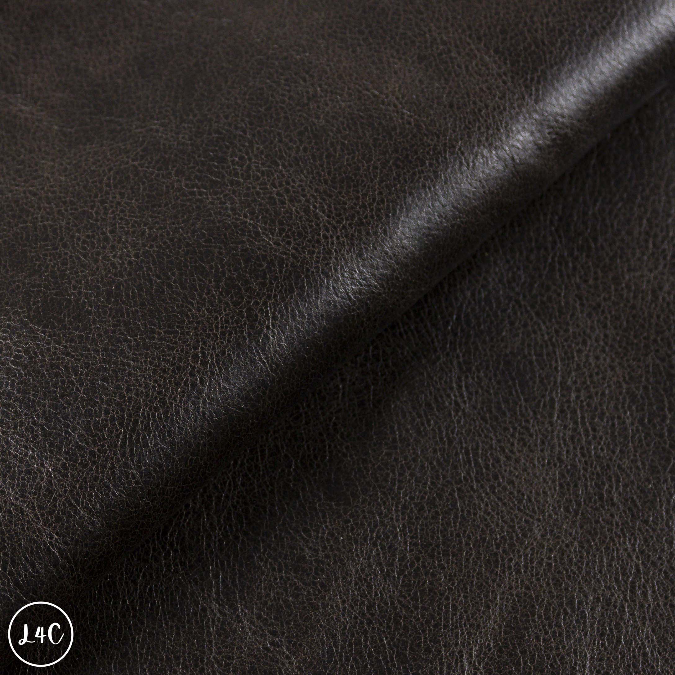 Close-up of dark brown leather texture