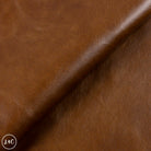 Close-up of brown leather fabric with visible texture
