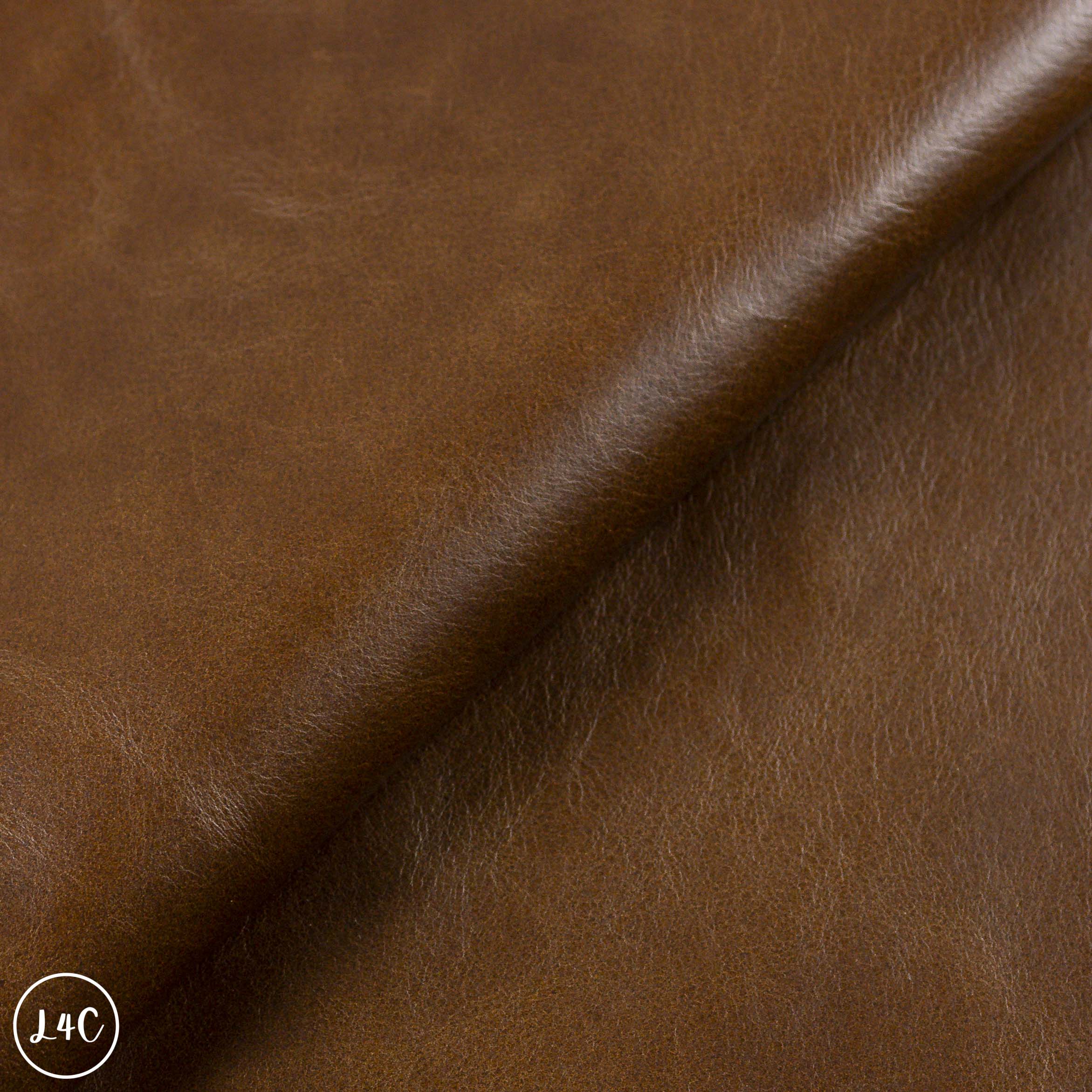 Close-up of brown leather fabric with visible texture