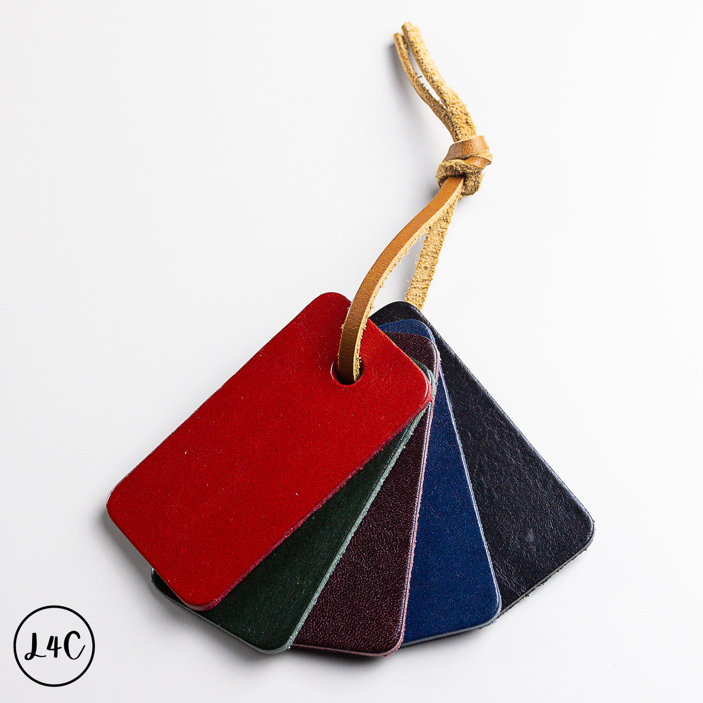 Set of four ciccilia leather samples on a string with a brand logo in the corner.