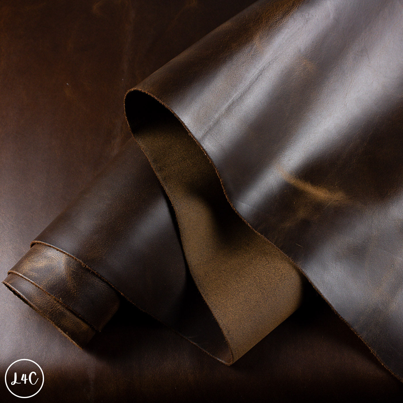 Brown leather hide with a subtle texture on a dark background
