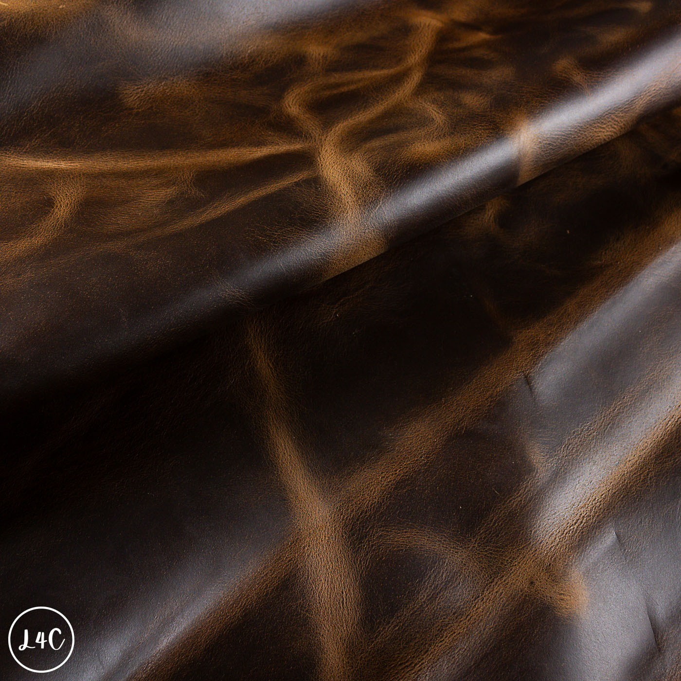 Close-up of brown dark honey leather with a subtle pattern