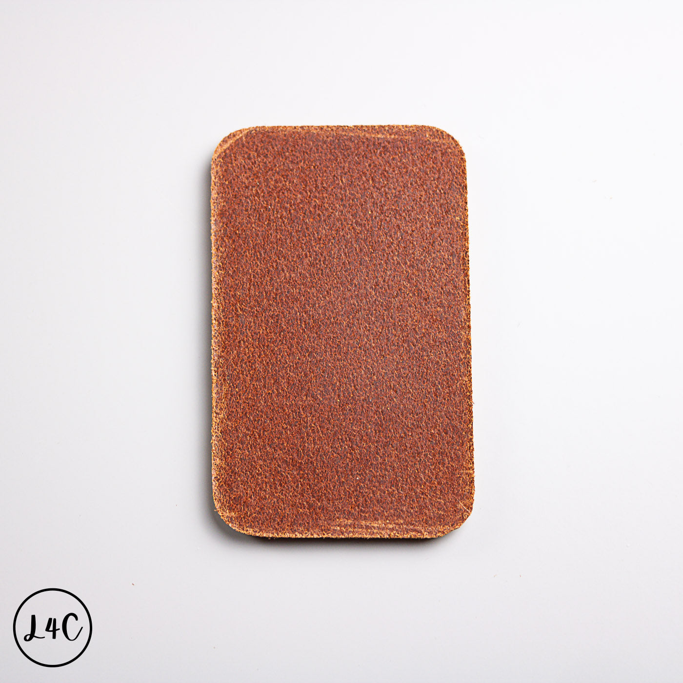 Satchel leather backing on a light gray background