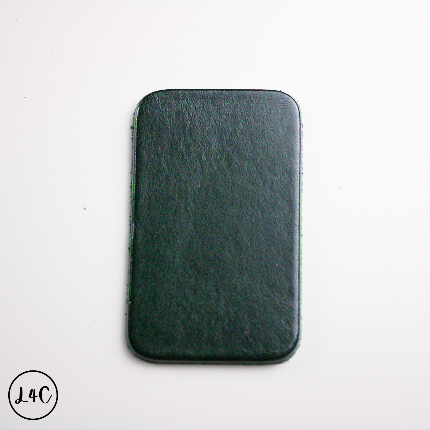 Dark green leather label on a white background