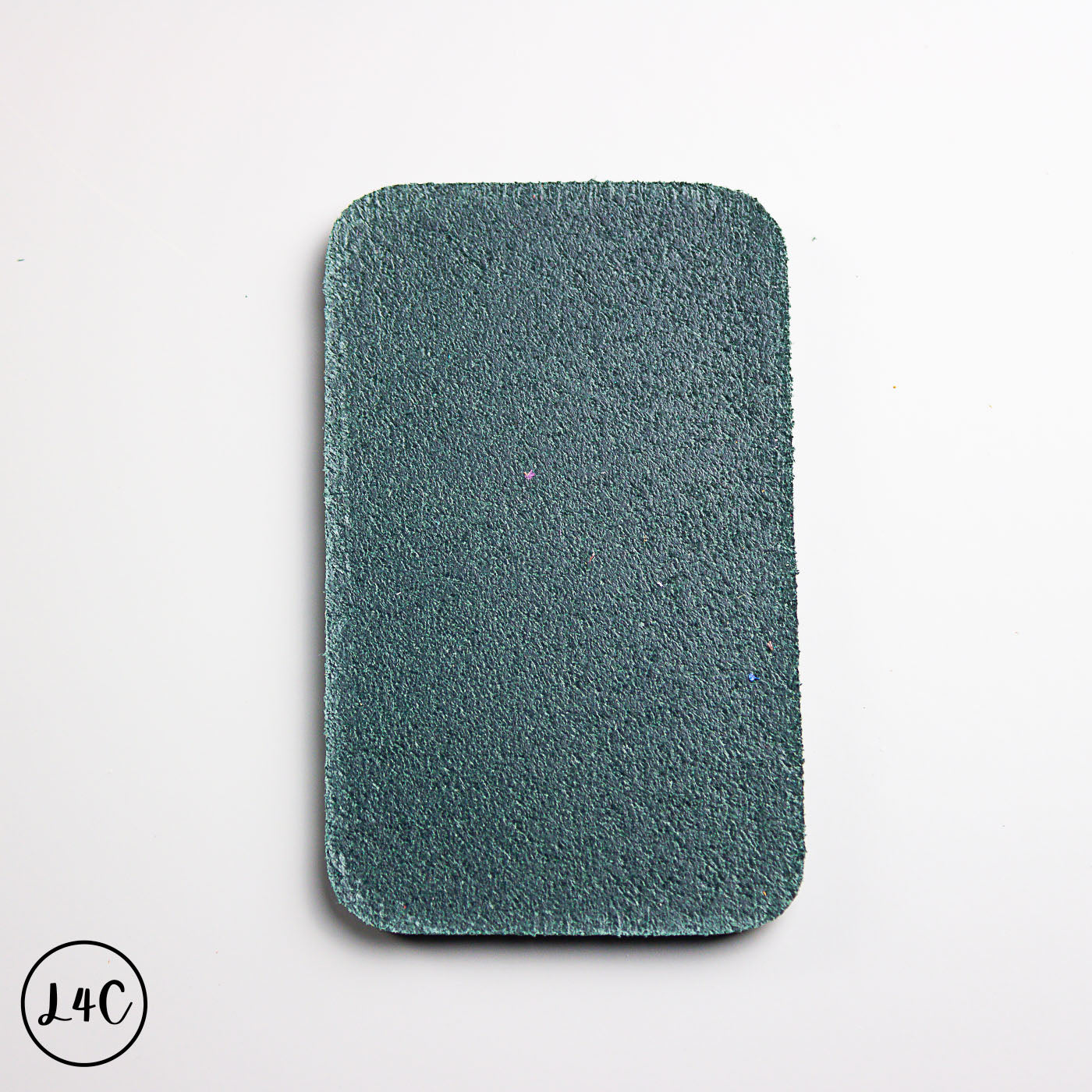 Rectangular olive leather backing on a white background