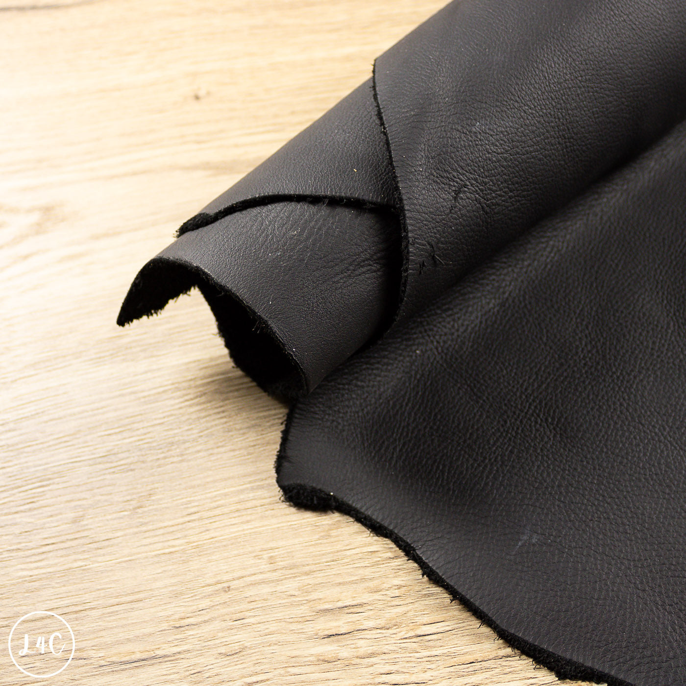 Black leather on a wooden surface