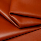 Close-up of brown leather with folds