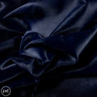 Close-up of dark blue leather with visible texture