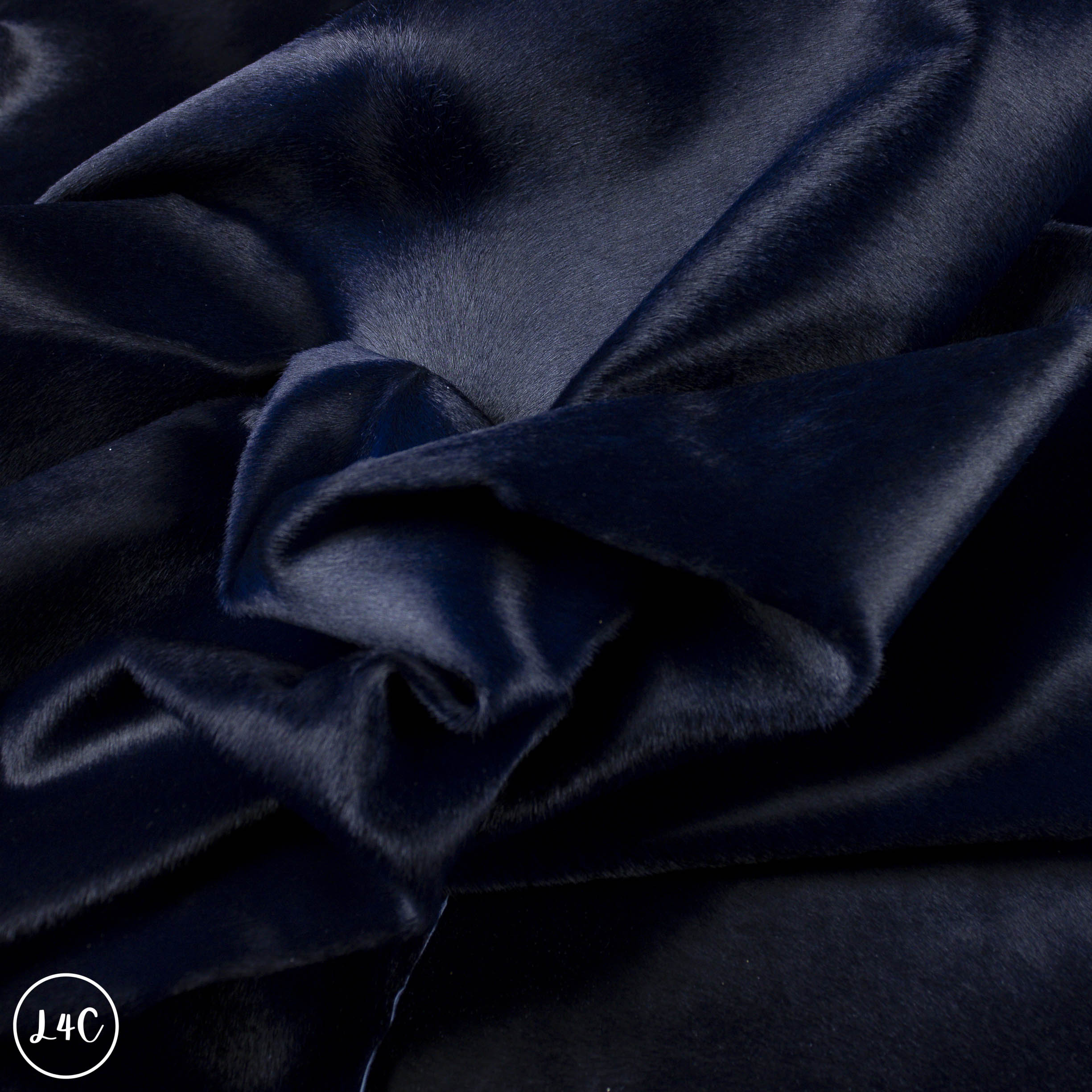 Close-up of dark blue leather with visible texture