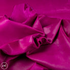 Close-up of purple leather with a glossy finish