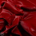 Close-up of dark red leather with visible texture