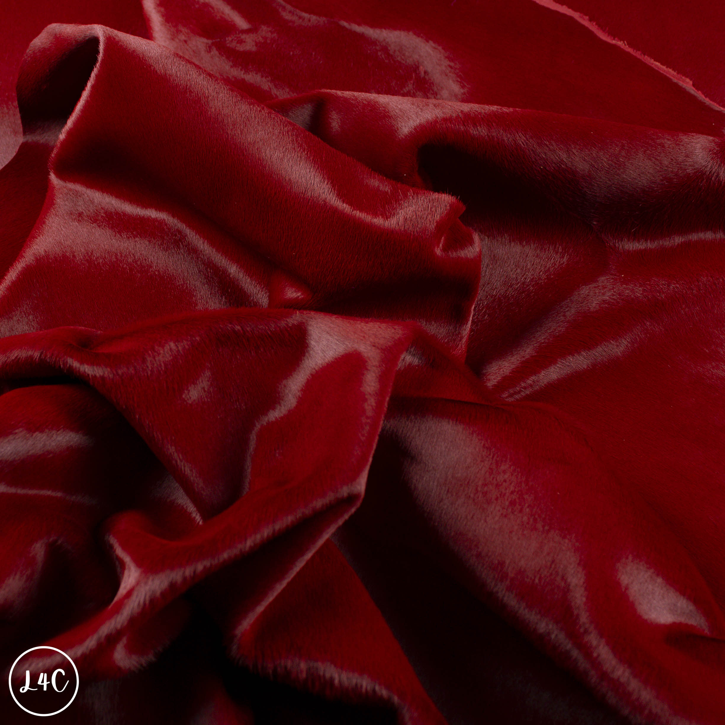 Close-up of dark red leather with visible texture