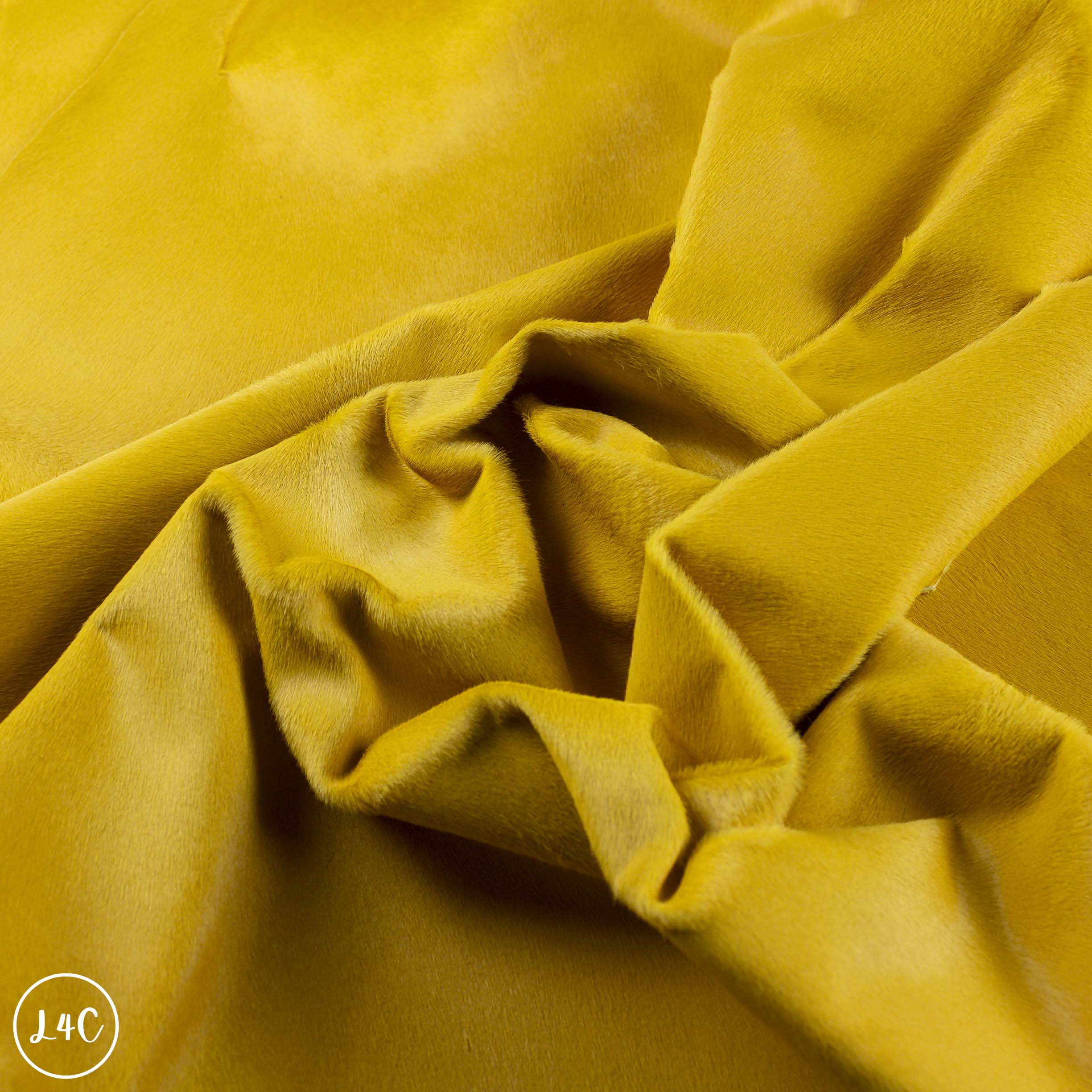 Close-up of yellow leather with visible hair texture