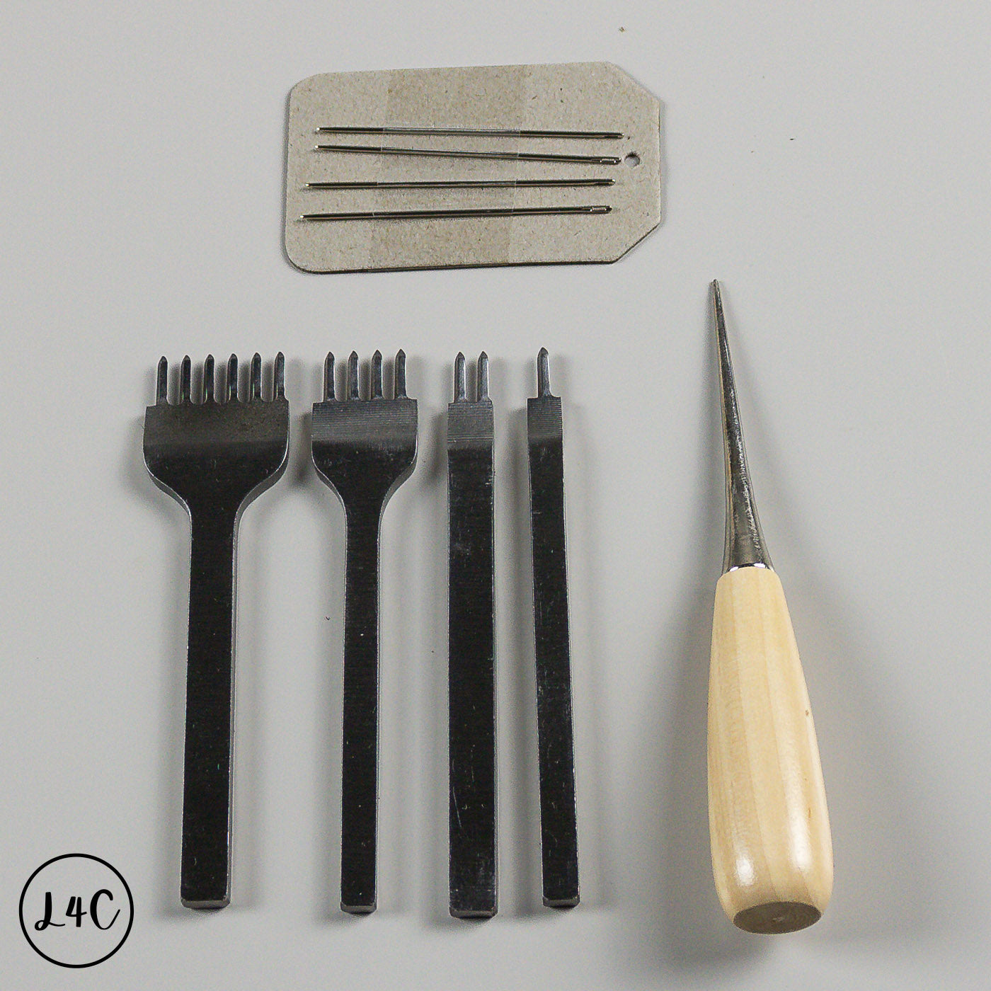 Set of black tools and a wooden-handled tool on a gray background