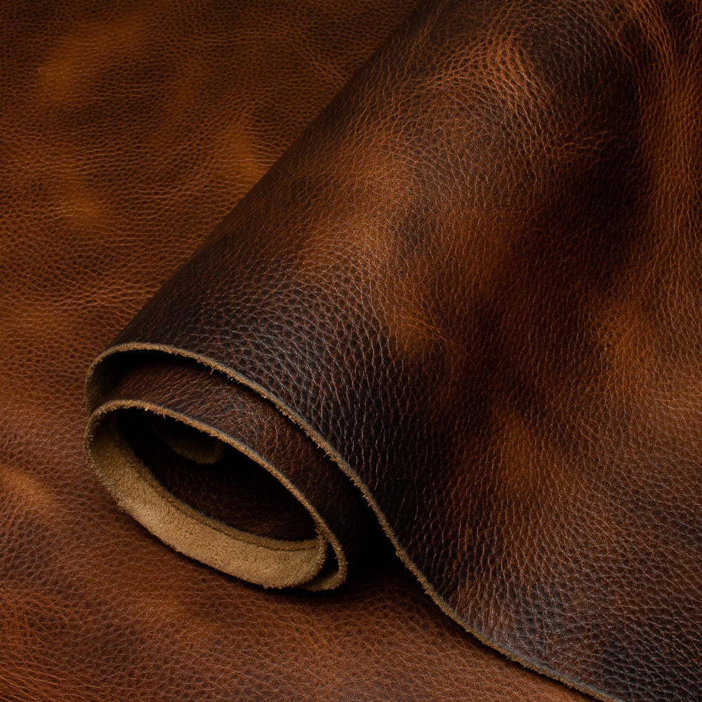 Close-up of brown leather fabric with a roll