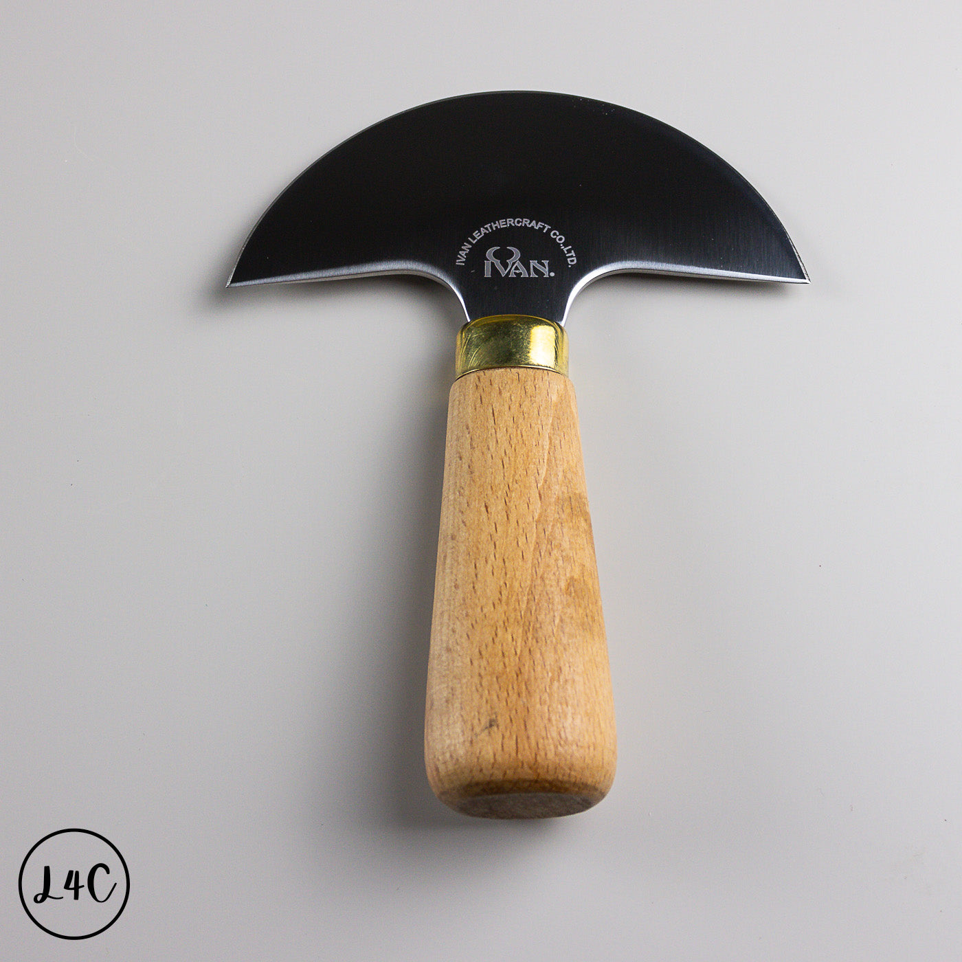 Knife with a wooden handle and metal blade on a gray background