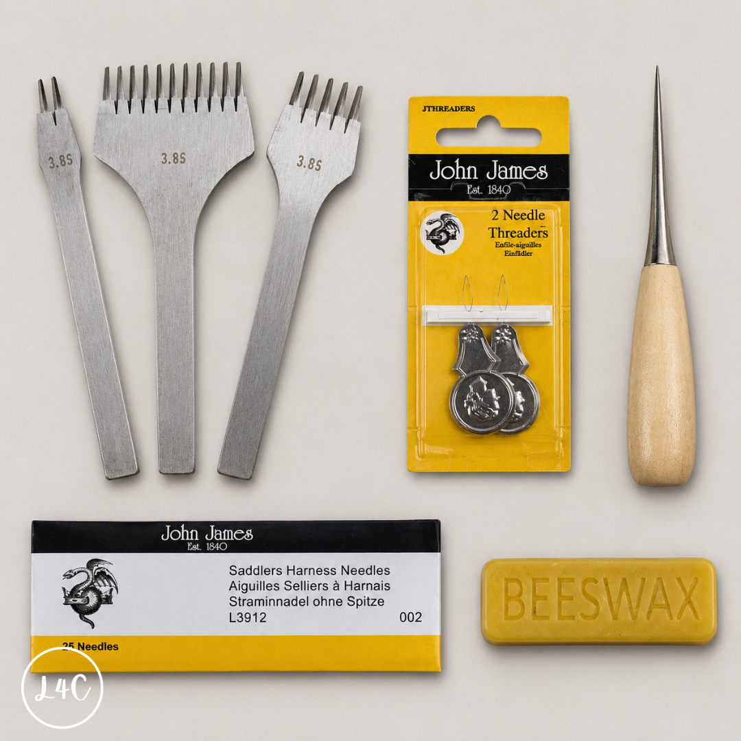 Saddler's needles, threaders, and a bar of beeswax on a light gray background.