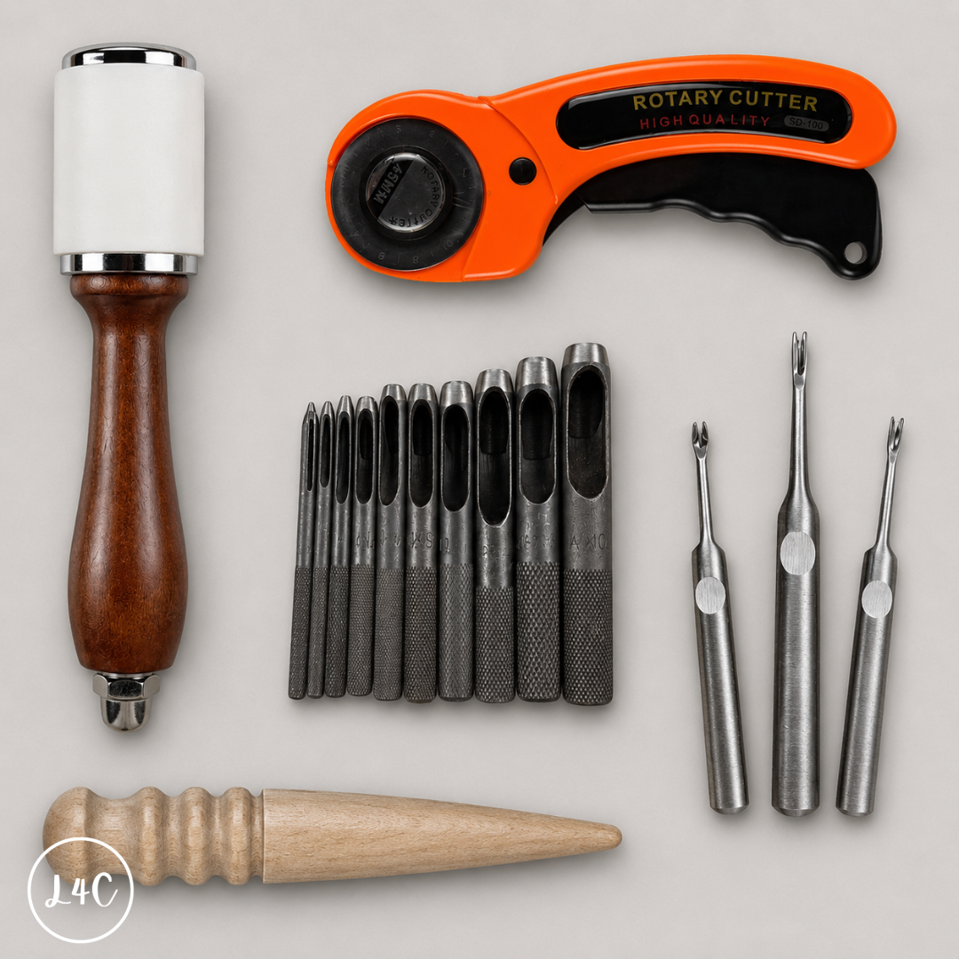 Collection of rotary cutter and accessories on a light gray background