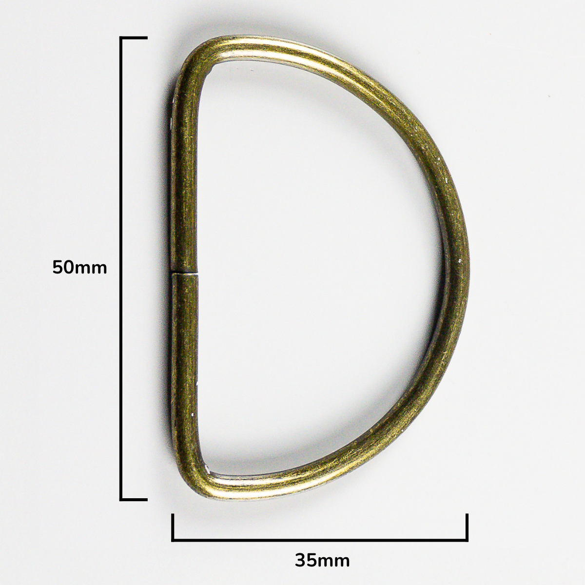 Brass D-ring with measurements on a white background