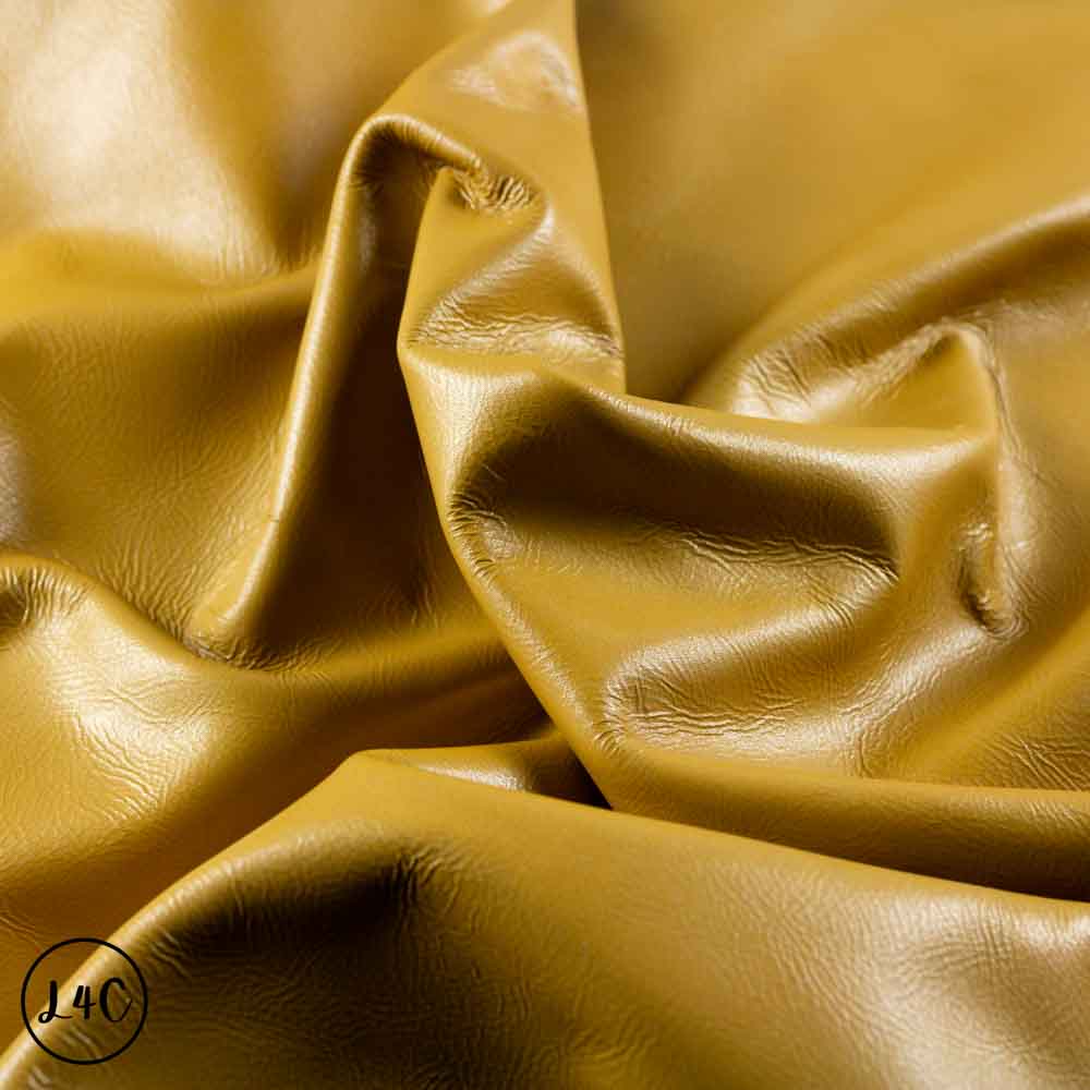 Close-up of yellow leather fabric with visible texture