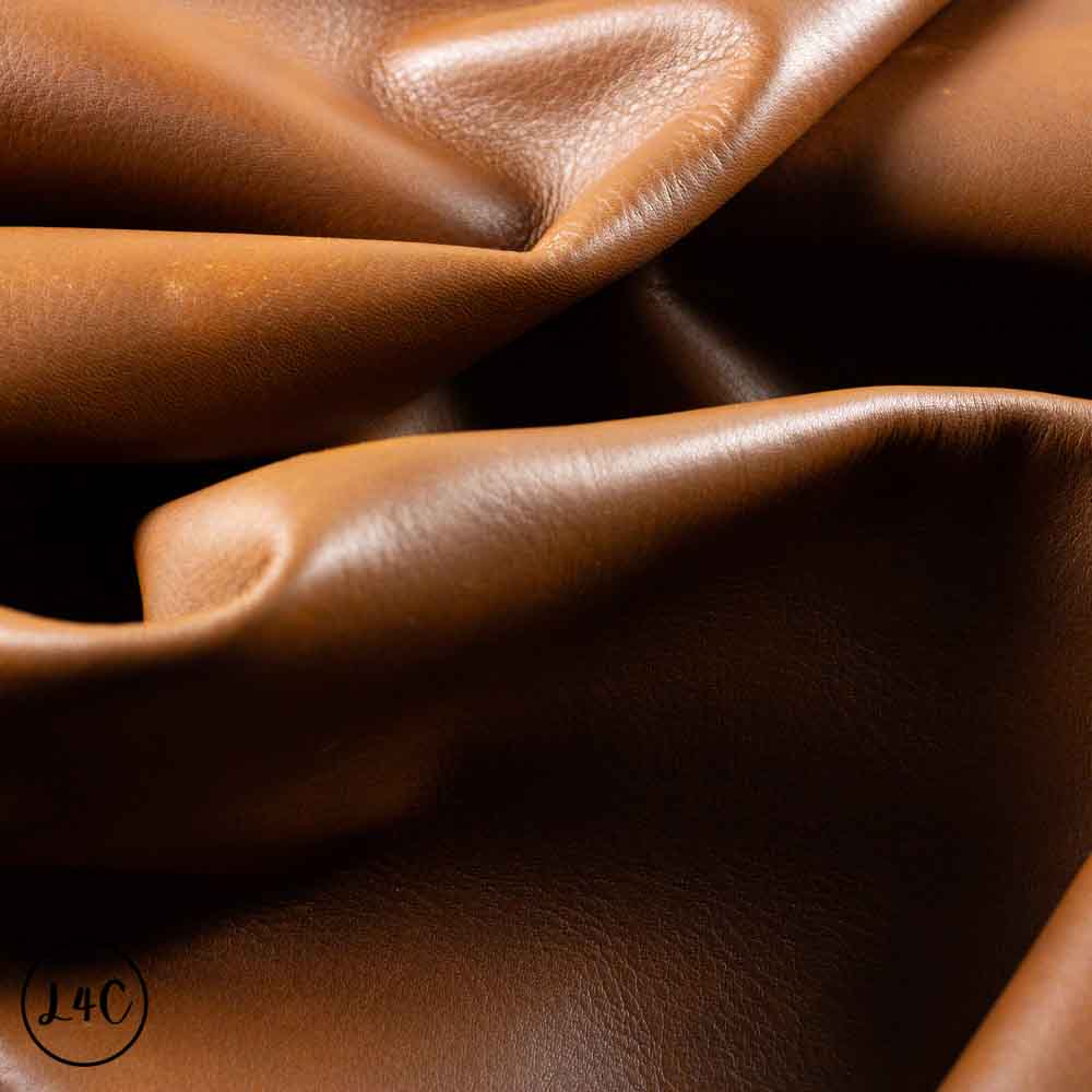 Close-up of brown leather texture showing folds