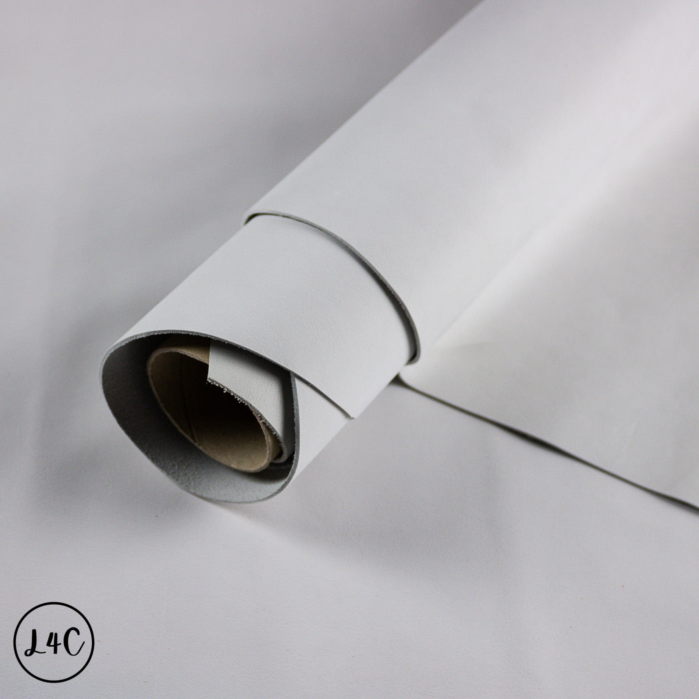 Roll of gray vinyl wrap on a light gray background