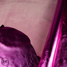 Close-up of hot pink lamb foil leather  fabric with a textured surface