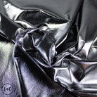 Close-up of metallic silver fabric with folds