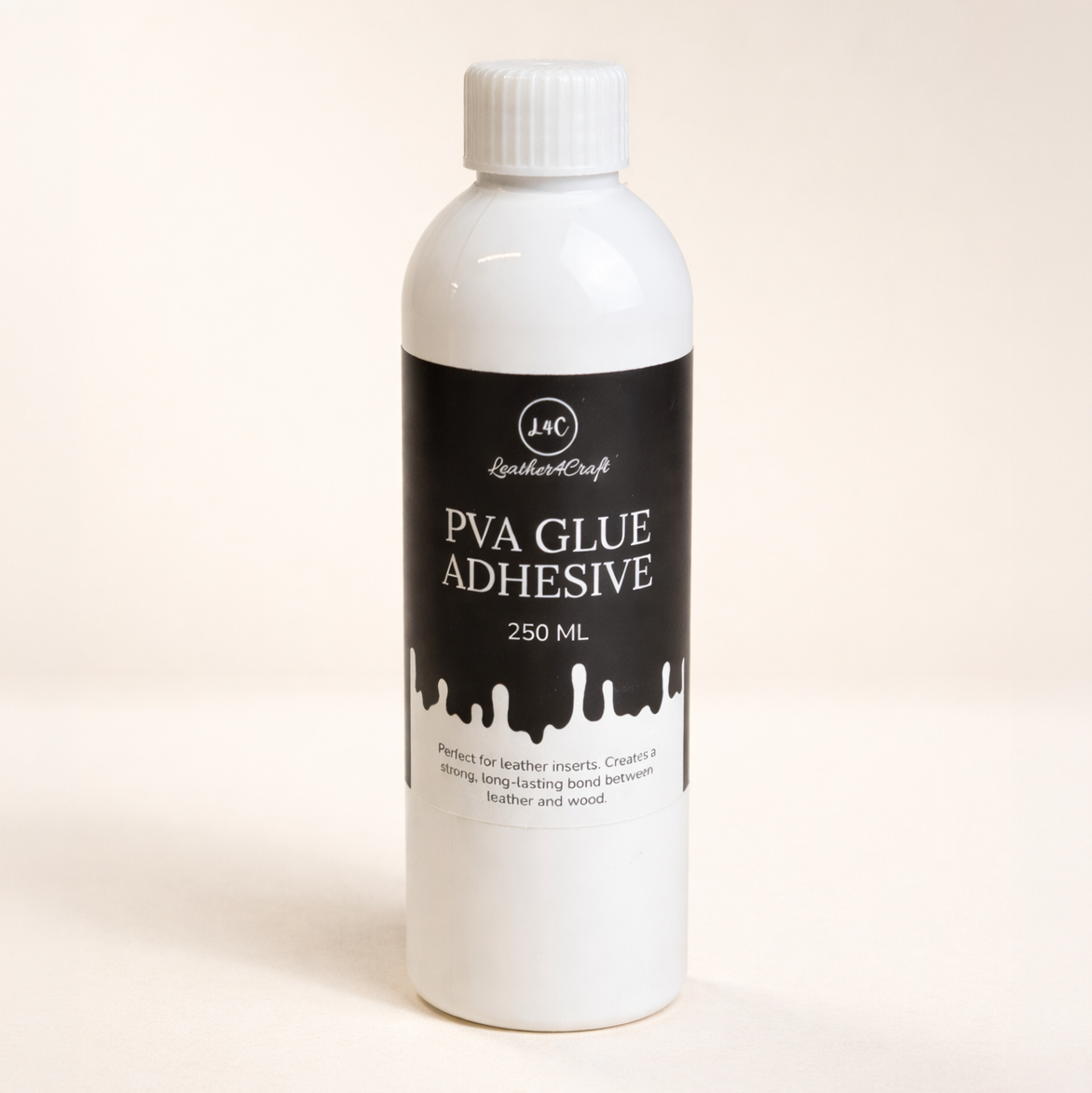 Bottle of PVA Glue Adhesive with a black label on a beige background