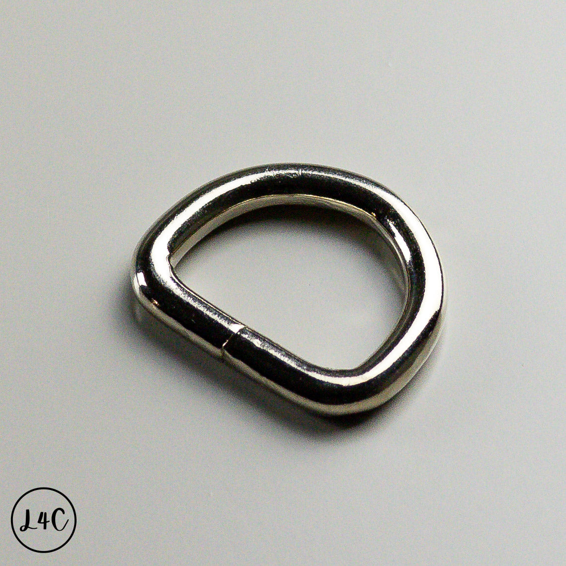 Metal D-ring on a gray background