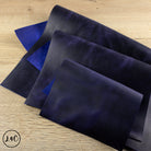 grape crazy horse leather panels on a wooden surface