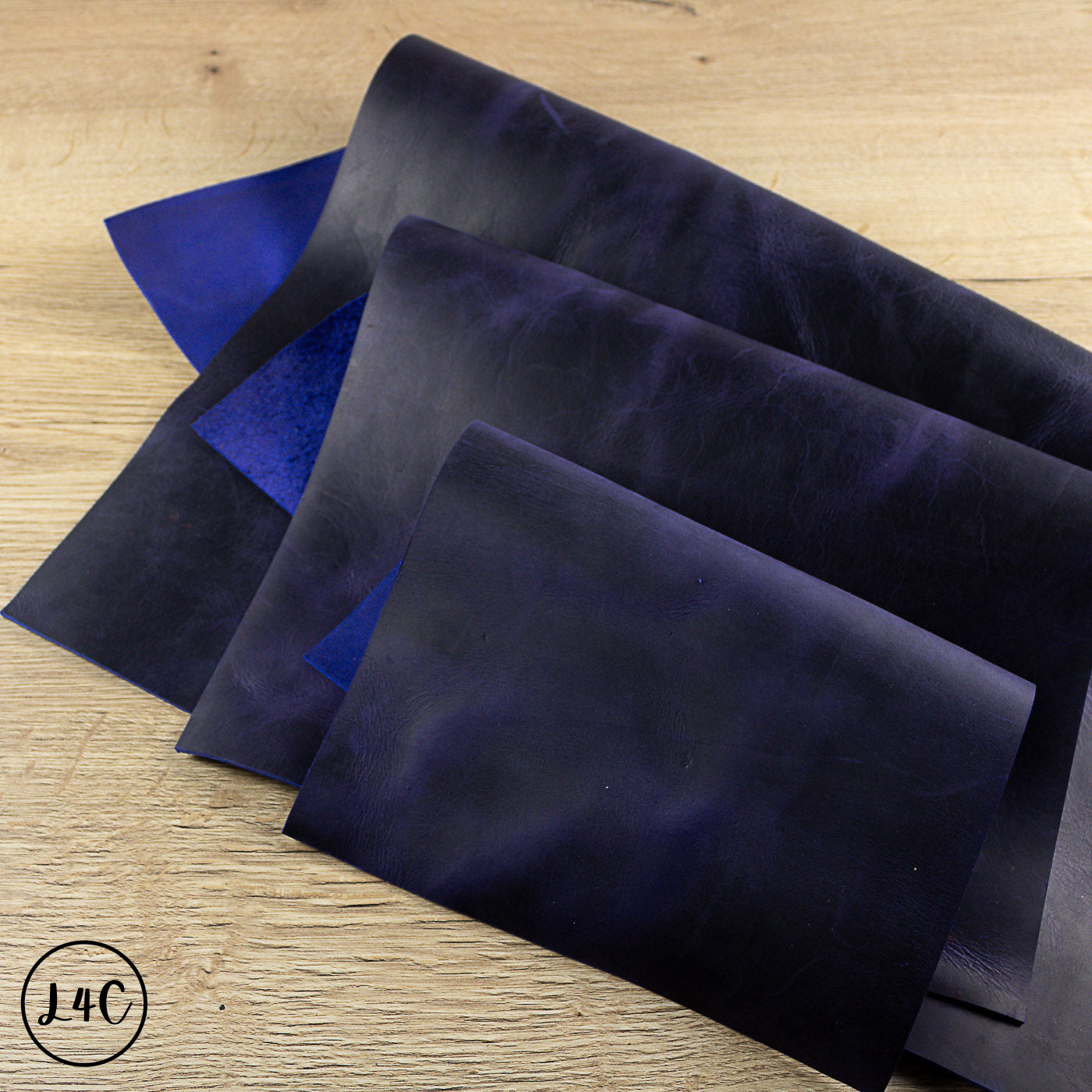 grape crazy horse leather panels on a wooden surface