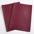 Two burgundy leather panels on a white background