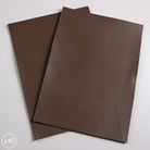 Two brown calf leather panels on a white background