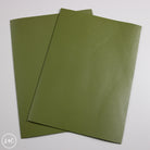 Two green calf leather panels on a white background