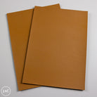 Two Tan calf leather panels on a white background