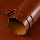 Brown leather roll on a brown background