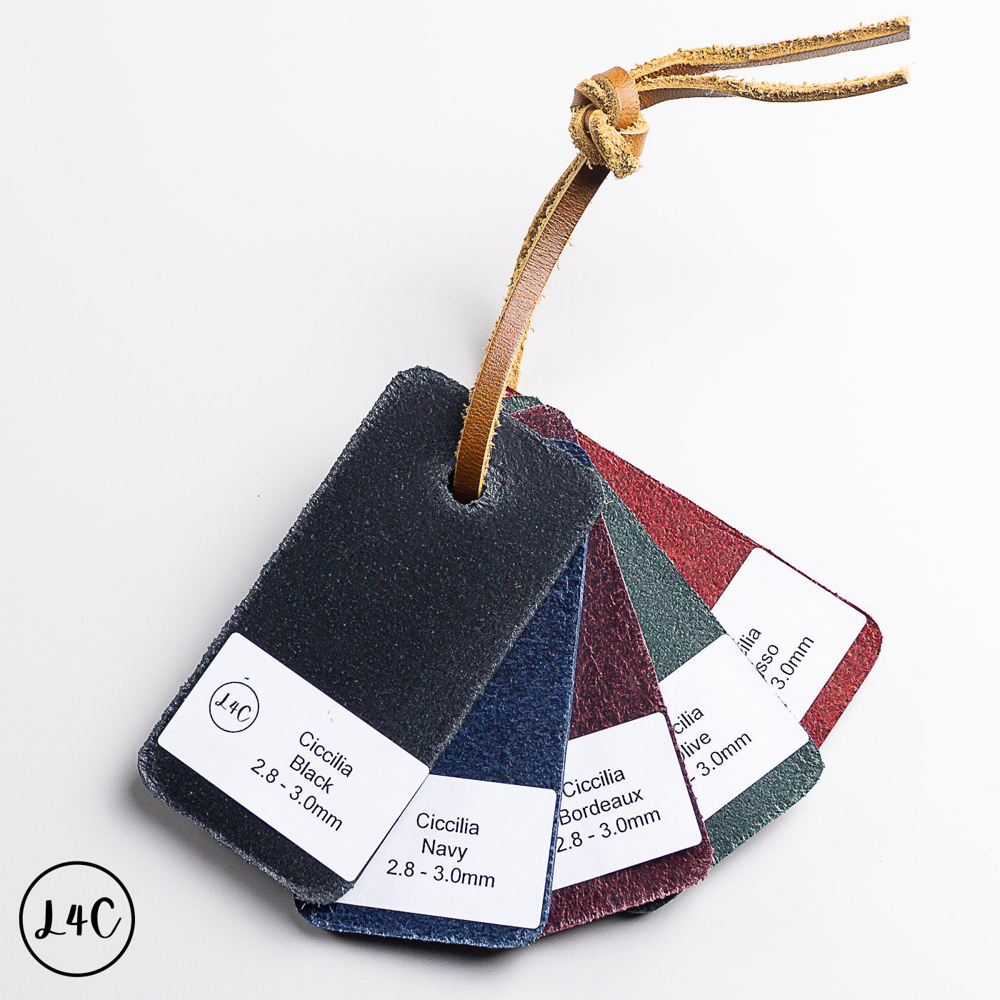 Set of four ciccilia leather samples on a string with a brand logo in the corner.
