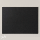 Solid black poundo board for leather crafting on a light gray background