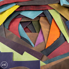 Collection of multicolored country soft leather off cuts arranged in a circular pattern.
