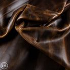 Close-up of brown leather fabric with visible texture